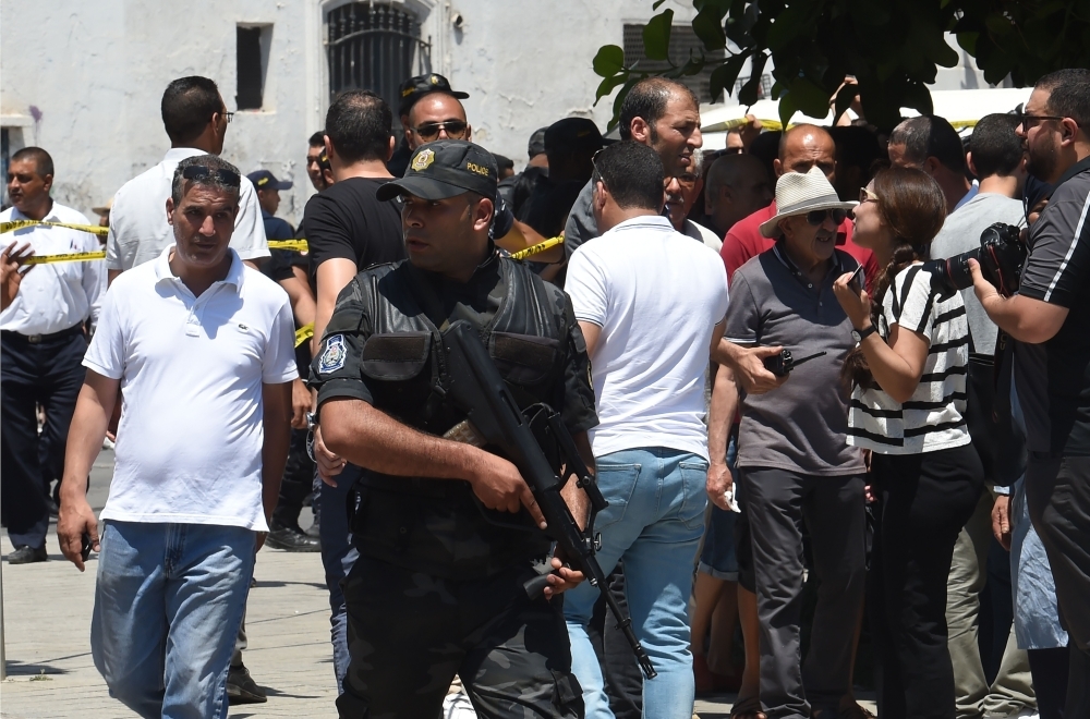 Tunisian security forces secure the area near the site of an attack in the Tunisian capital's main avenue Habib Bourguiba on Thursday. — AFP