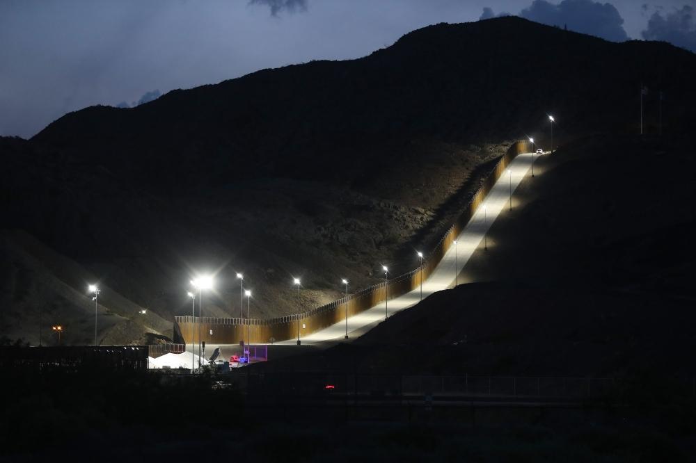 A section of border wall put in place by We Build The Wall Inc. stands at dusk in Sunland Park, New Mexico, on Wednesday. — AFP