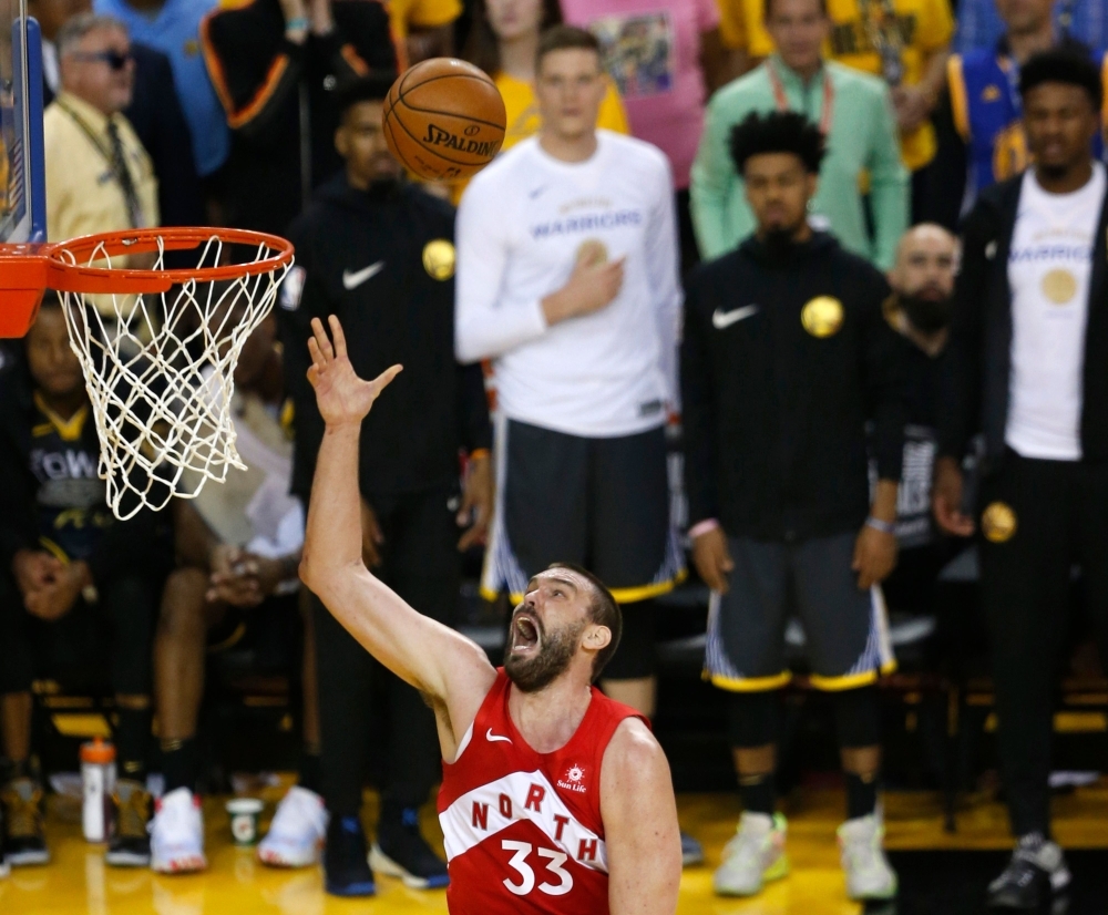 In this file photo taken on June 12, 2019, Marc Gasol of the Toronto Raptors attempts a shot  in the first half during Game Six of the 2019 NBA Finals at ORACLE Arena in Oakland, California.  Spanish center Gasol has exercised his $25.6 million one-season contract option to return to the NBA champion Toronto Raptors next season, the Canadian club announced on Wednesday. — AFP