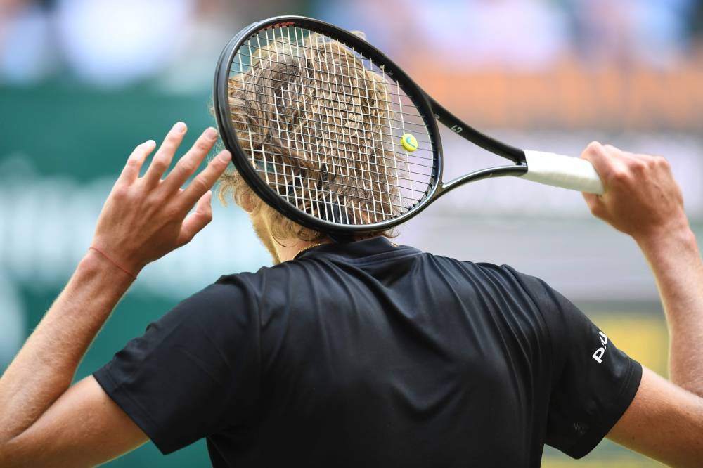 Alexander Zverev from Germany reacts during his match against David Goffin from Belgium at the ATP tennis tournament in Halle, western Germany, on Friday. — AFP 