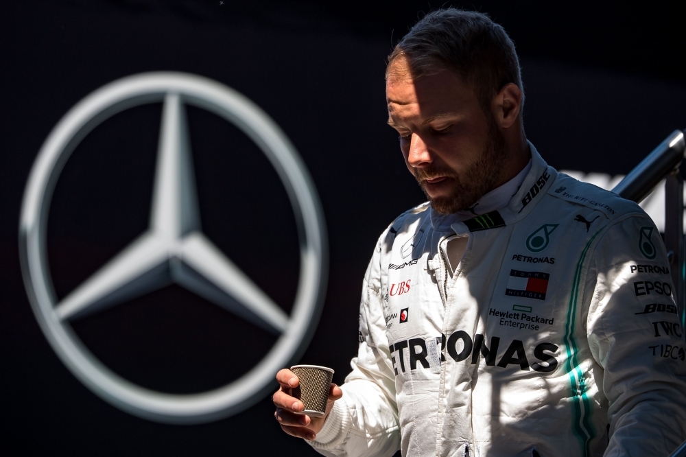 Mercedes' Finnish driver Valtteri Bottas walks to his garage during the first practice session of the Austrian Formula One Grand Prix at the Red Bull circuit in Spielberg, Austria on Friday. — AFP