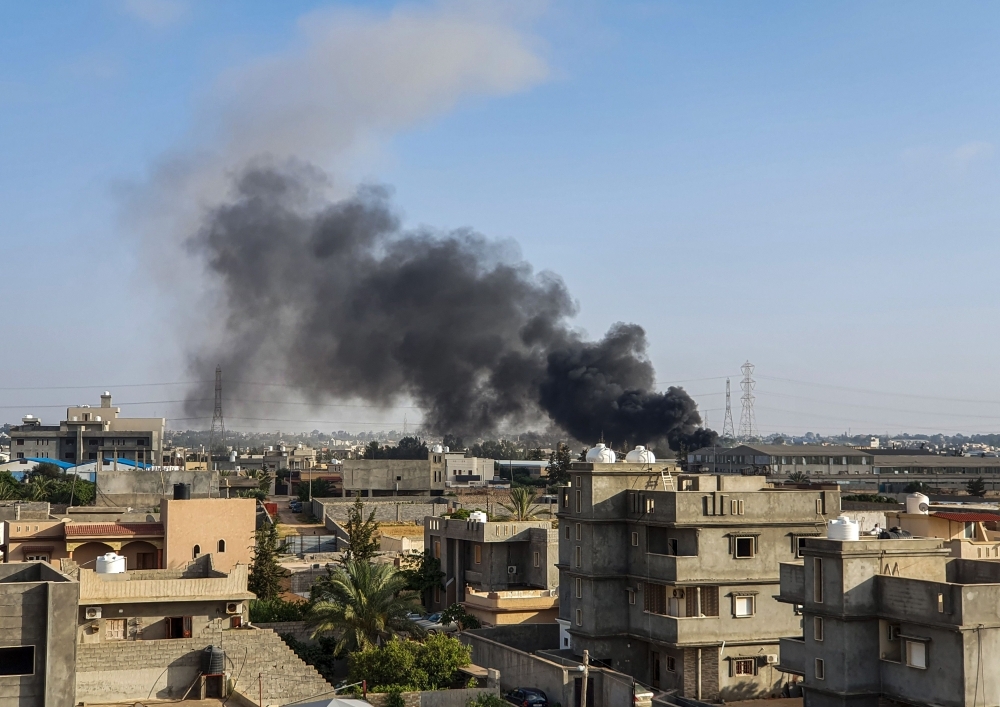 Smoke plumes rise in Tajoura, south of the Libyan capital Tripoli, following a reported airstrike by forces loyal to Gen. Khalifa Haftar. — AFP
