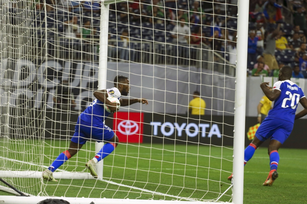 Haiti forward Duckens Nazon (9) celebrates after scoring against Canada during the second half during quarterfinal play in the CONCACAF Gold Cup soccer tournament at NRG Stadium. — Reuters