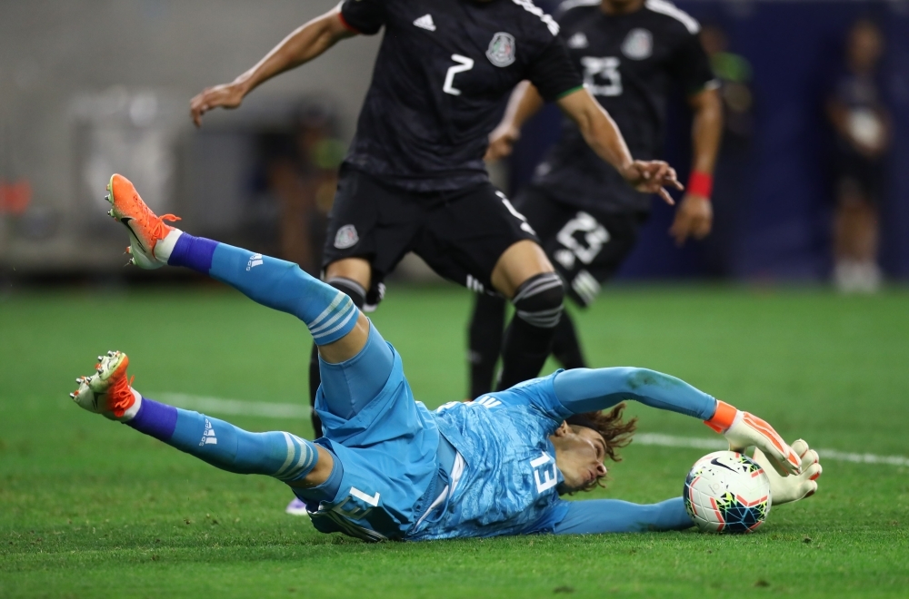 Guillermo Ochoa No.13 of Mexico rmakes a save against Costa Rica during the quarterfinals of the 2019 CONCACAF Gold Cup at NRG Stadium on Saturday in Houston, Texas. — AFP