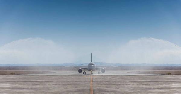 Saudia flight SV2030 lands at Neom Bay airport on Sunday.
