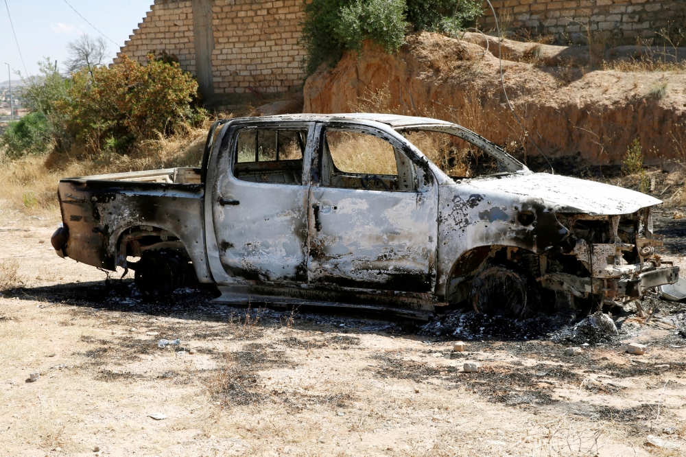 A burned-out vehicle belonging to eastern forces led by Khalifa Haftar, is seen in Gharyan, south of Tripoli, Libya, in this June 27, 2019 file photo. — Reuters