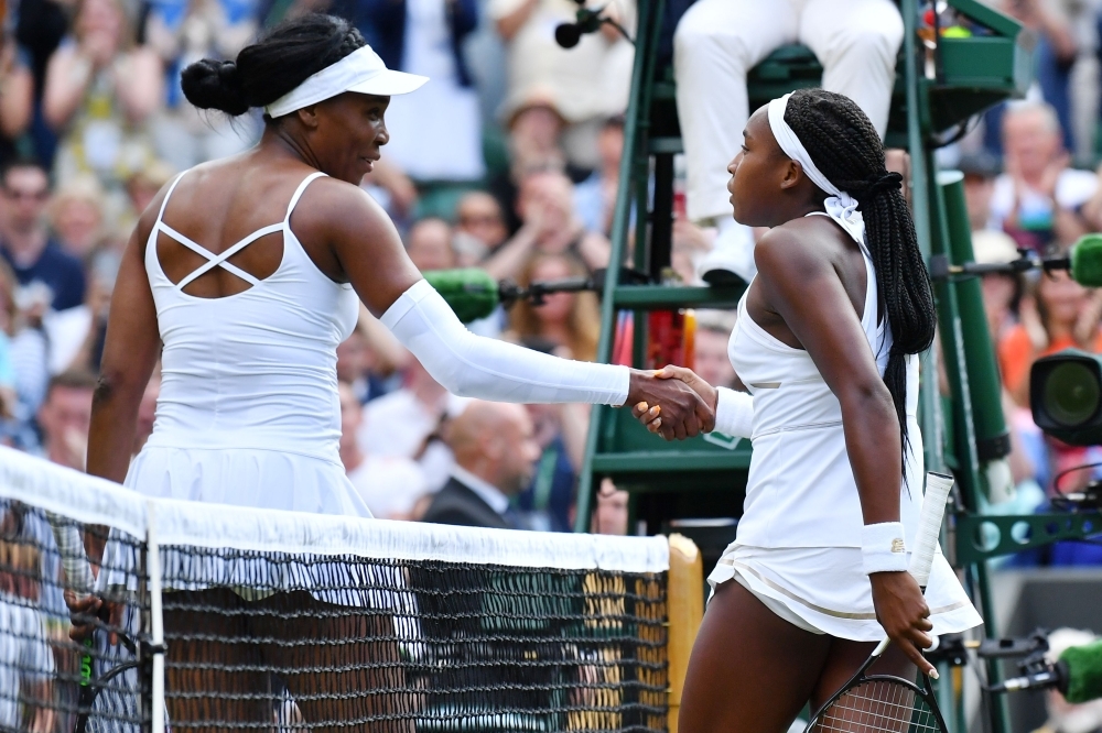 US player Cori Gauff is congratulated by US player Venus Williams after winning their women's singles first round match on the first day of the 2019 Wimbledon Championships at The All England Lawn Tennis Club in Wimbledon, southwest London, on Monday. — AFP