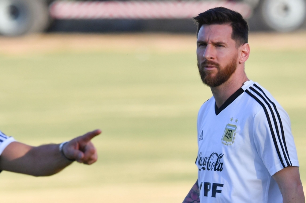 Argentina's Lionel Messi (2-L) and Argentina's Sergio Aguero (2-R) speak to teammates during a practice session in Belo Horizonte, Brazil, on Monday, on the eve of the Copa America tournament semi-final football match between Argentina and Brazil. — AFP