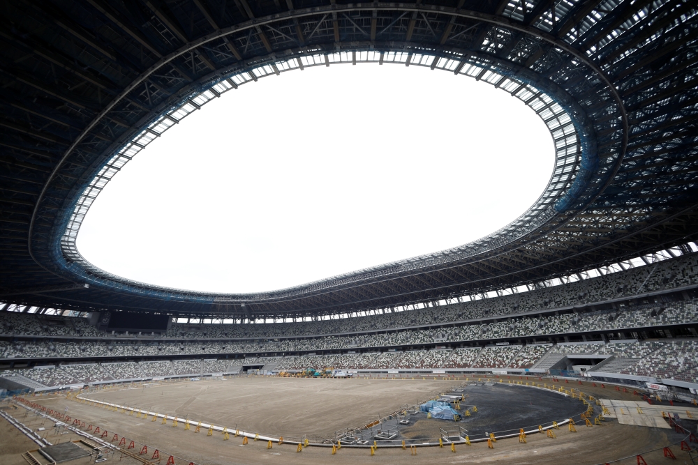 The New National Stadium, the main stadium of Tokyo 2020 Olympics and Paralympics, is seen under construction in Tokyo, Japan, on Wednesday. — Reuters