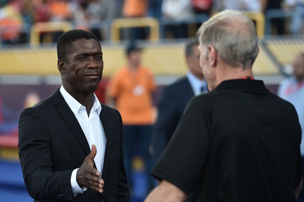 Cameroon's coach Clarence Seedorf (L) shakes hands with Benin's coach Michel Dussuyer prior to the 2019 Africa Cup of Nations (CAN) Group F football match at the Ismailia Stadium in the north-eastern Egyptian city on Tuesday. — AFP