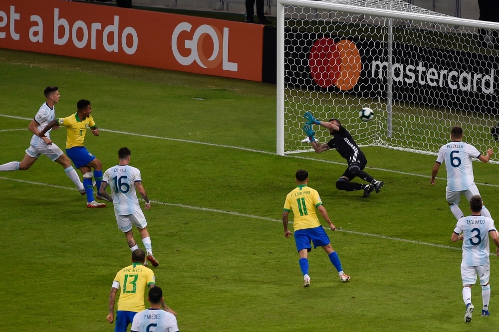 Brazil's Gabriel Jesus (2-L) scores past Argentina's goalkeeper Franco Armani during their Copa America football tournament semifinal match at the Mineirao Stadium in Belo Horizonte, Brazil, on Tuesday. — AFP