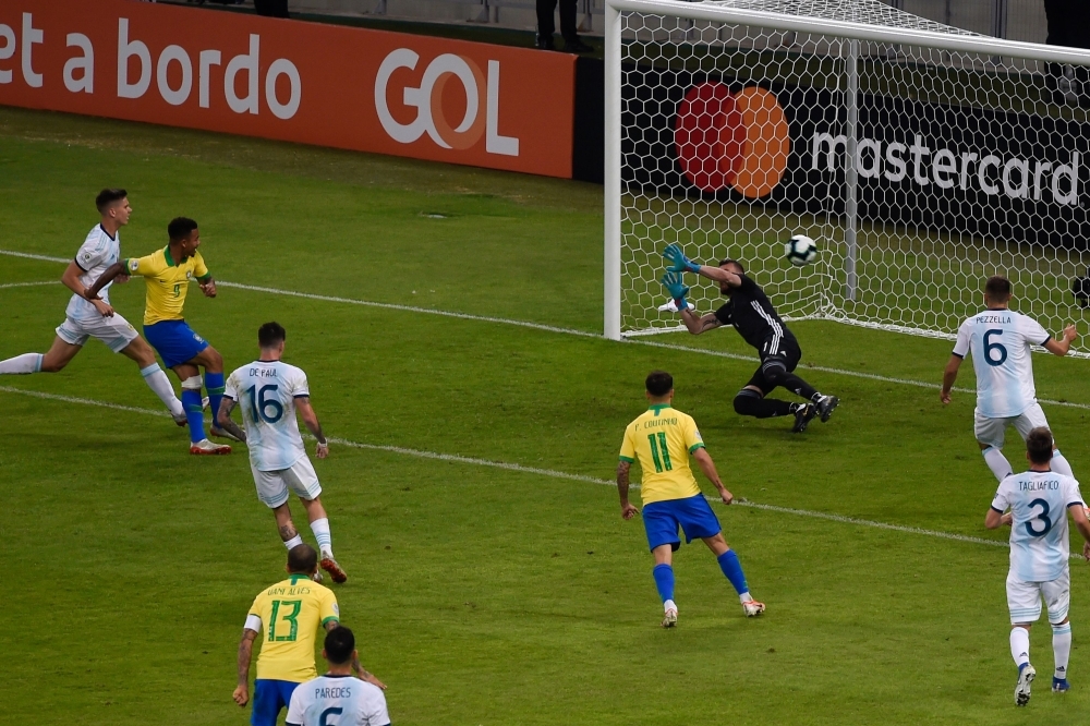 Brazil's Gabriel Jesus (2-L) scores past Argentina's goalkeeper Franco Armani during their Copa America football tournament semifinal match at the Mineirao Stadium in Belo Horizonte, Brazil, on Tuesday. — AFP