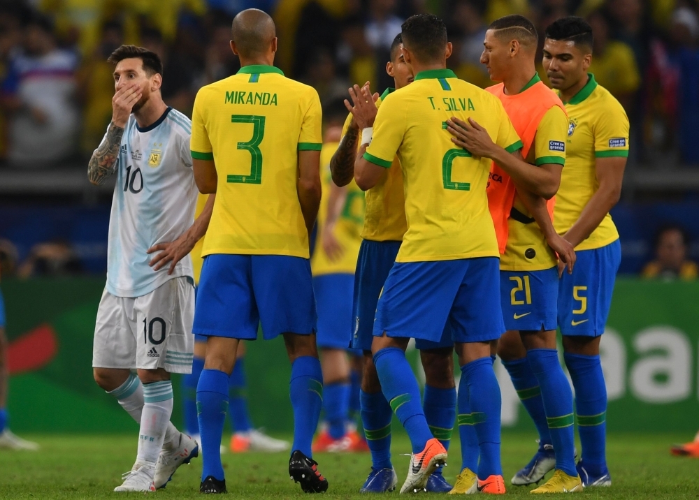 Brazil's Gabriel Jesus (2-L) scores past Argentina's goalkeeper Franco Armani during their Copa America football tournament semifinal match at the Mineirao Stadium in Belo Horizonte, Brazil, on Tuesday. — AFP