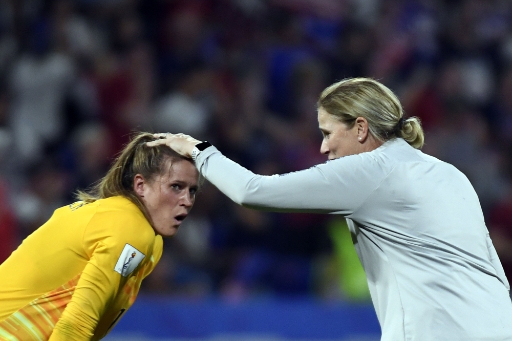 United States' coach Jillian Ellis (L) speaks to United States' defender Abby Dahlkemper  during the France 2019 Women's World Cup semifinal football match against England on Tuesday at the Lyon Satdium in Decines-Charpieu, central-eastern France. — AFP