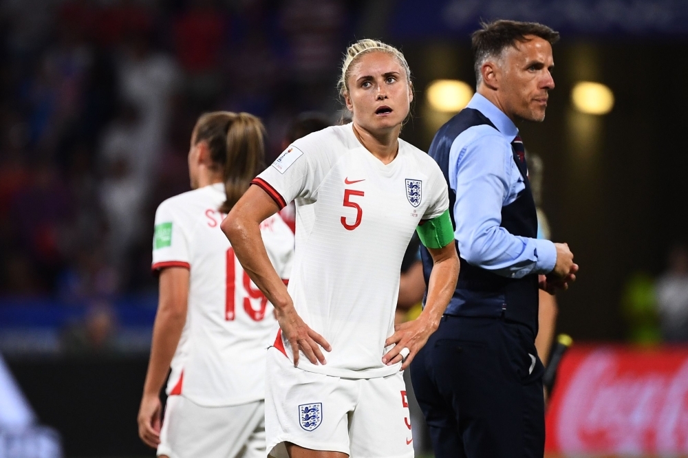 England's coach Phil Neville (R) and England's defender Steph Houghton (L) react after losing the France 2019 Women's World Cup semifinal football match against USA, at the Groupama Stadium, Lyon, France, on Tuesday. — Afp