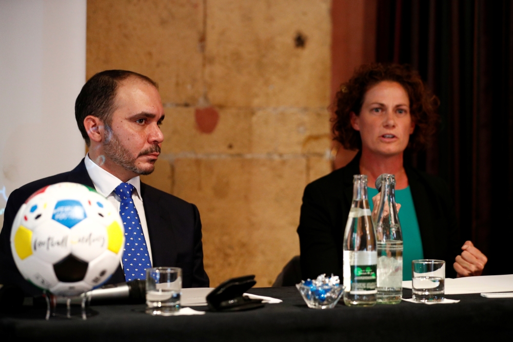 Jordan's Prince Ali Bin Al Hussein, founder and chairman of the Association Football Development Program Global (AFDP) and Kelly Lindsey, coach of Afghanistan Women's National Football Team, launch a campaign to stop abuse, harassment and exploitation in women's soccer in Lyon, France, on Wednesday. — Reuters