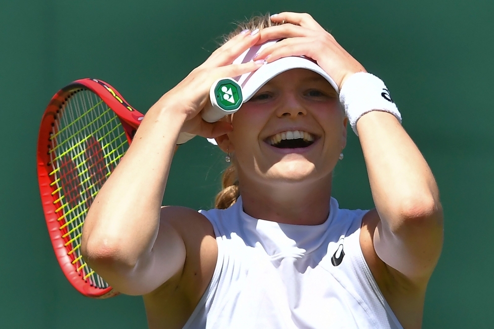 Britain's Harriet Dart celebrates beating Brazil's Beatriz Haddad Maia after their women's singles second round match on the fourth day of the 2019 Wimbledon Championships at The All England Lawn Tennis Club in Wimbledon, southwest London, on Thursday. — AFP