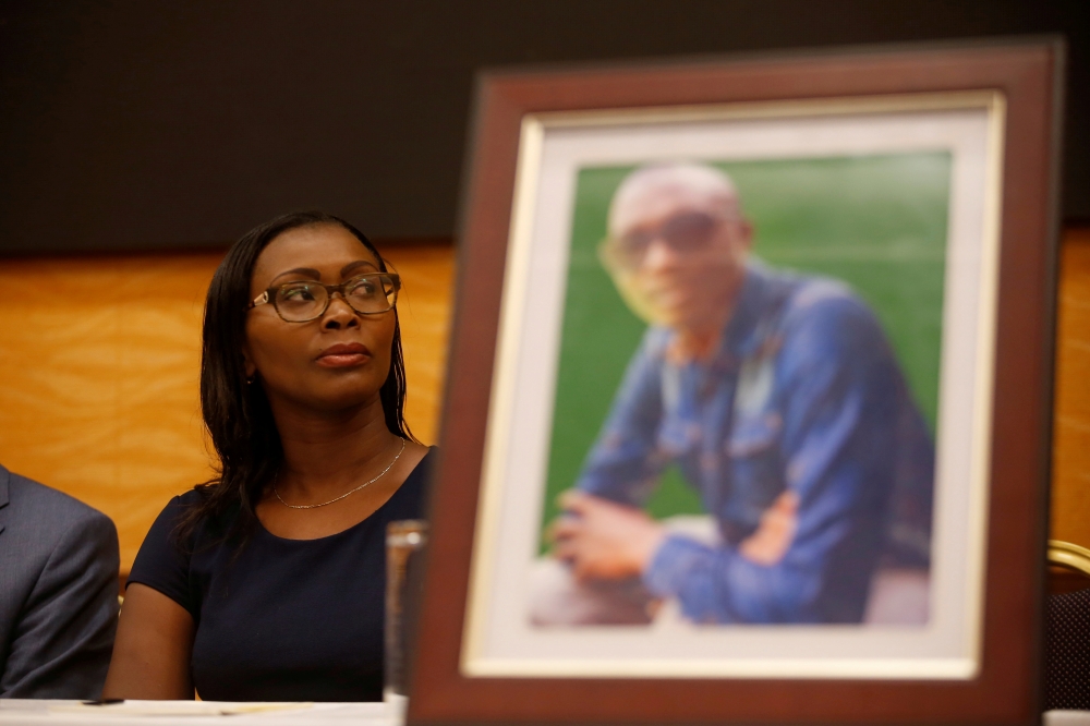 Esther Kabau-Wanyoike the sister of Kenyan George Kabau who died in the Ethiopian Airlines crash sit next to his picture during a news conference where her lawyers announced they plan to file a wrongful-death lawsuit against Boeing, at the Serene hotel in Nairobi, Kenya, in this April 16, 2019 file photo. — Reuters
