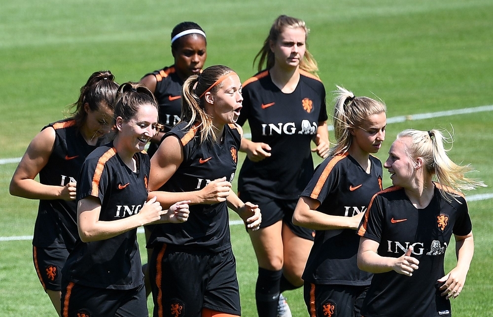 Netherlands' players run during a training session in Oullins near Lyon on Friday during the France 2019 football Women's World Cup. The Netherlands will face USA for the final of the France 2019 Women's World Cup. — AFP