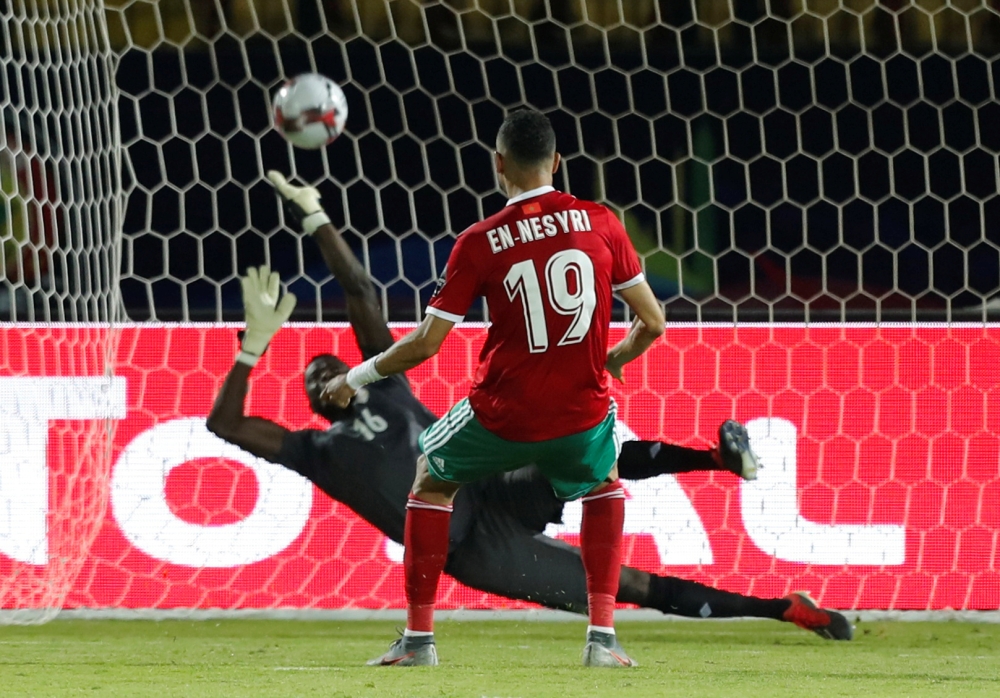 Benin's forward Desire Segbe Azankpo scores during the penalty shootout of the 2019 Africa Cup of Nations (CAN) Round of 16 football match against Morocco at the Al-Salam Stadium in the Egyptian capital Cairo on Friday. — AFP