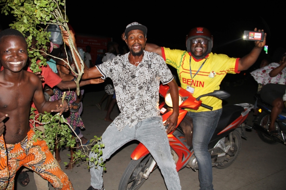 Benin's fan celebrate in the streets of Cotonou capital city after the national football team defeated Morocco at the on-going 2019 Africa Cup of Nations round of 16 match, on Friday. — AFP