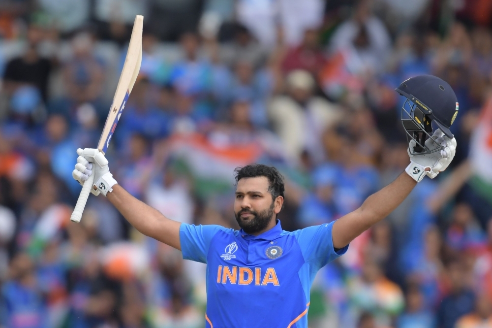 India's Rohit Sharma celebrates after reaching his century during the 2019 Cricket World Cup group stage match between Sri Lanka and India at Headingley in Leeds, northern England, on Saturday. — AFP