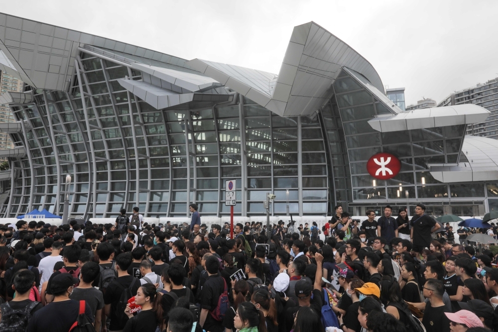 Protesters gather near the West Kowloon railway station on Sunday during a demonstration against a proposed extradition bill in Hong Kong. — AFP