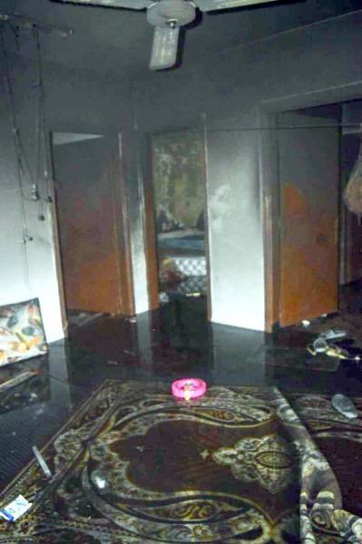 Firefighters enter the burning apartment in Al-Faisaliyyah district of Riyadh.