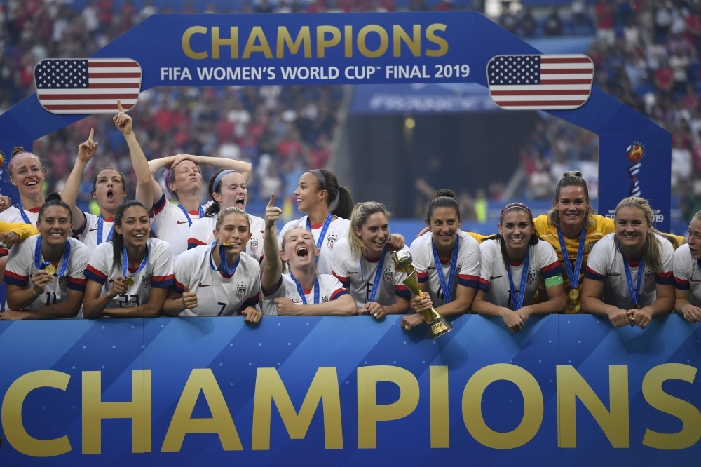 USA's players celebrate with the trophy after the France 2019 Women’s World Cup football final match between USA and the Netherlands at the Lyon Stadium in Lyon, central-eastern France, on Sunday. — AFP