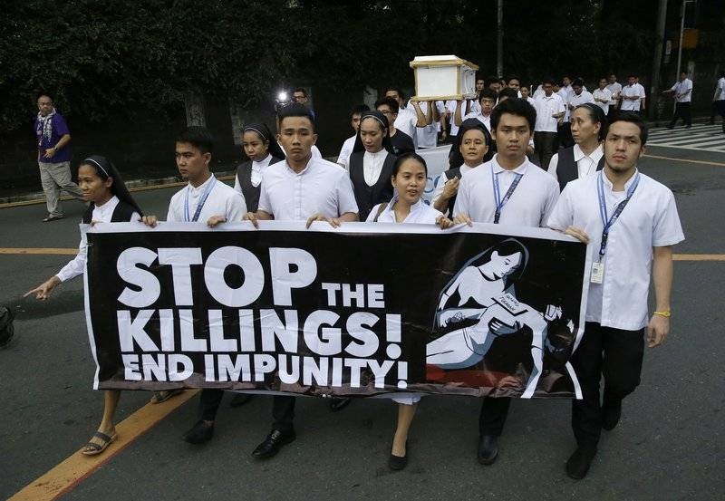 In this Aug. 29, 2018 file photo, seminarians and nuns carry slogans and a mock coffin during a rally in Manila against drug-related killings and martial law. – Courtesy photo