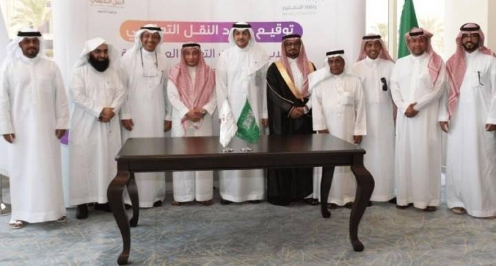 Dr. Fahad Al-Shaya, CEO of Tatweer Educational Transportation Services Company, pose for a photo with contractors after the signing ceremony in Riyadh on Monday.