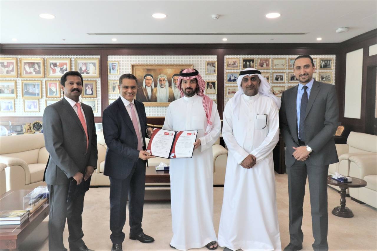 Ahmed Fawzi Kanoo, Director at YBA Kanoo Group, (center)  with YBA Kanoo’s IT team
