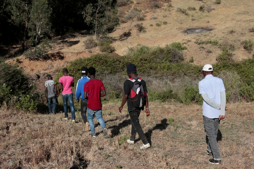 African migrants walk in a hiding place in the mountains away from sights near the city of Tangier, Morocco, as authorities intensify their crackdown against illegal migrants sending them south to prevent crossings to Spain, in this June 25, 2019 file photo. — Reuters