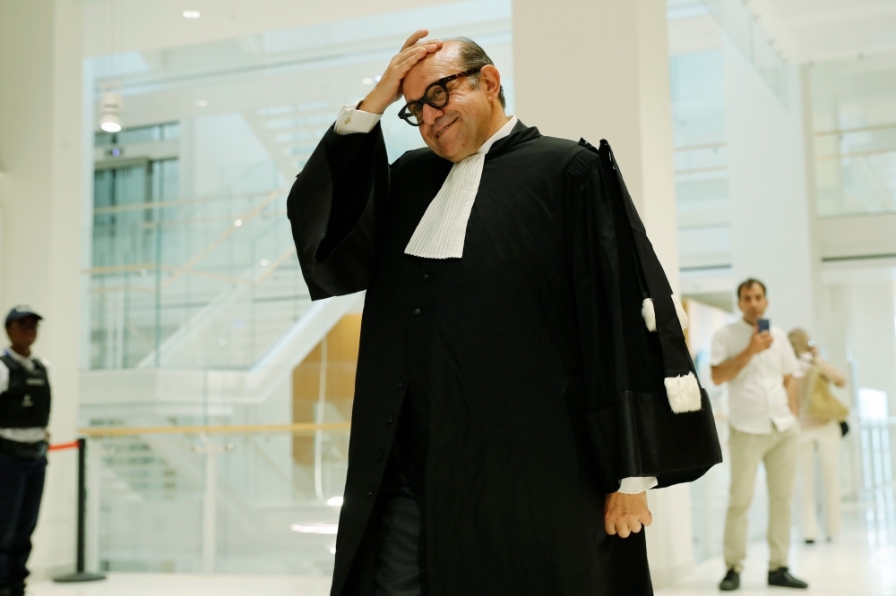 French lawyers Herve Temime, right, reacts at the Paris courthouse on Tuesday, at the end of the trial of his client, French businessman Bernard Tapie, who was accused of defrauding the state of nearly half a billion euros with a massive 2008 arbitration award. — AFP