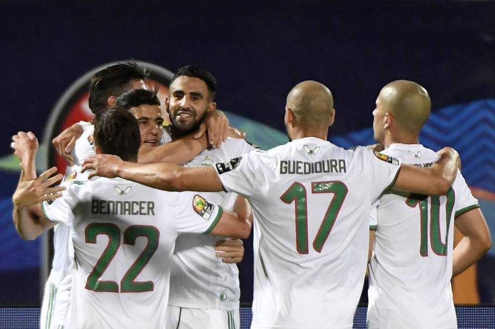 Algeria's forward Riyad Mahrez (4th-L) celebrates after scoring a goal during the 2019 Africa Cup of Nations (CAN) Round of 16 football match between Algeria and Guinea at the 30 June Stadium in the Egyptian capital Cairo on Sunday. — AFP