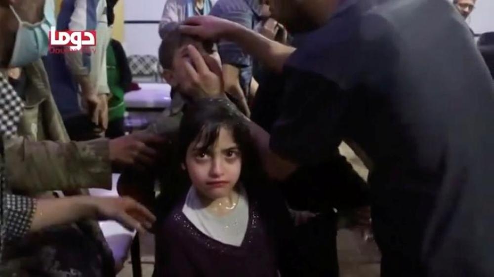 A girl looks on following alleged chemical weapons attack, in what is said to be Douma, Syria, in this still image from video on April 8, 2018. — Reuters
