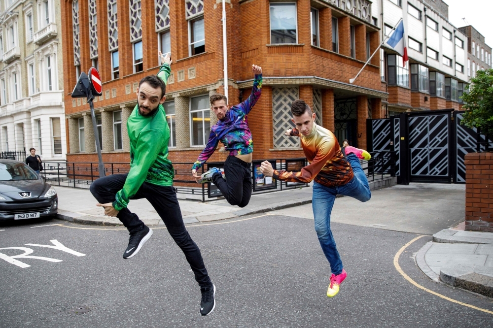 Members of French dance collective La Horde, left, Kevin Martinelli, center, Mathieu Douay and Edgar Scassa perform at the Institut Francais in London on July 10, 2019 during a photo-call to promote the launch of FranceDance UK.  FranceDance UK, a four-month festival is set to bring French contemporary dance to venues across the country, starting at the Edinburgh International Festival on Aug. 8, 2019. — AFP