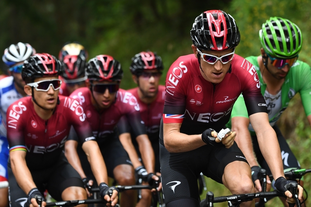 Great Britain's Geraint Thomas, second right, eats followed by Colombia's Egan Bernal, left, teammates and Slovakia's Peter Sagan, right, wearing the best sprinter's green jersey during the sixth stage of the 106th edition of the Tour de France cycling race between Mulhouse and La Planche des Belles Filles, on Thursday. — AFP