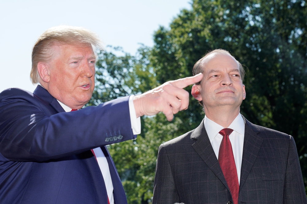 US President Donald Trump announces the resignation of Labor Secretary Alex Acosta, right,  before departing for travel to Milwaukee, Wisconsin from the South Lawn of the White House in Washington, on Friday. — Reuters