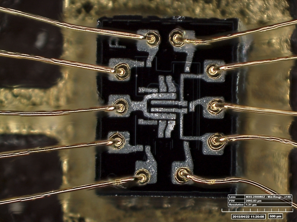 This undated handout photo released by the Smithsonian National Air and Space Museum on Thursday shows a microscopic view of dual, three-element NOR gate, the inside of a silicon chip, used in Apollo. — AFP