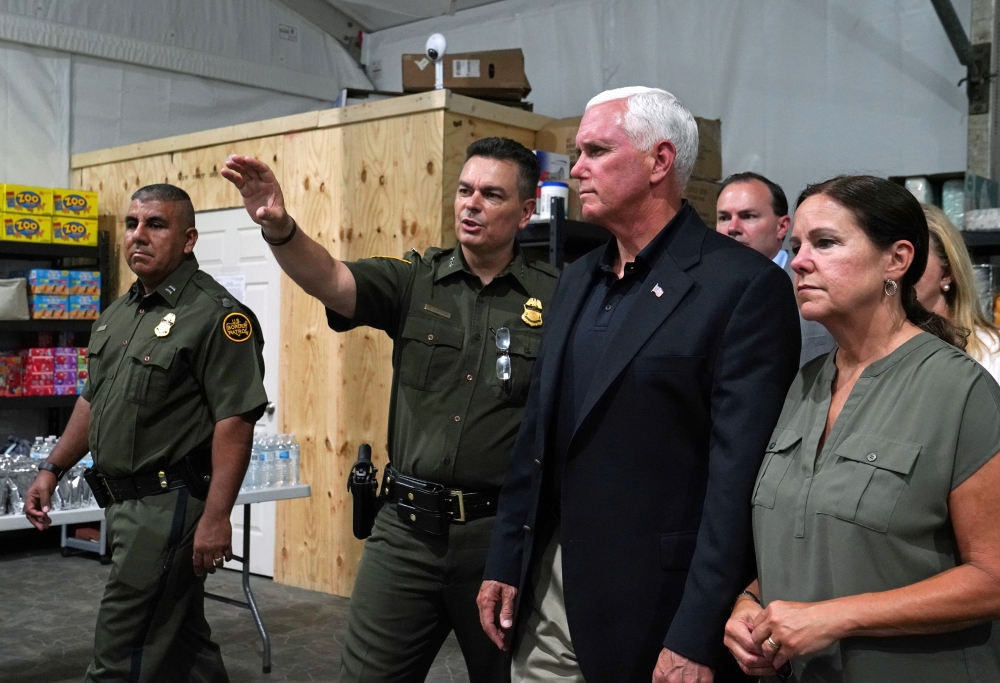 US Vice President Mike Pence tours the Donna Soft-Sided Processing Facility in Donna, Texas, on Friday. -Reuters