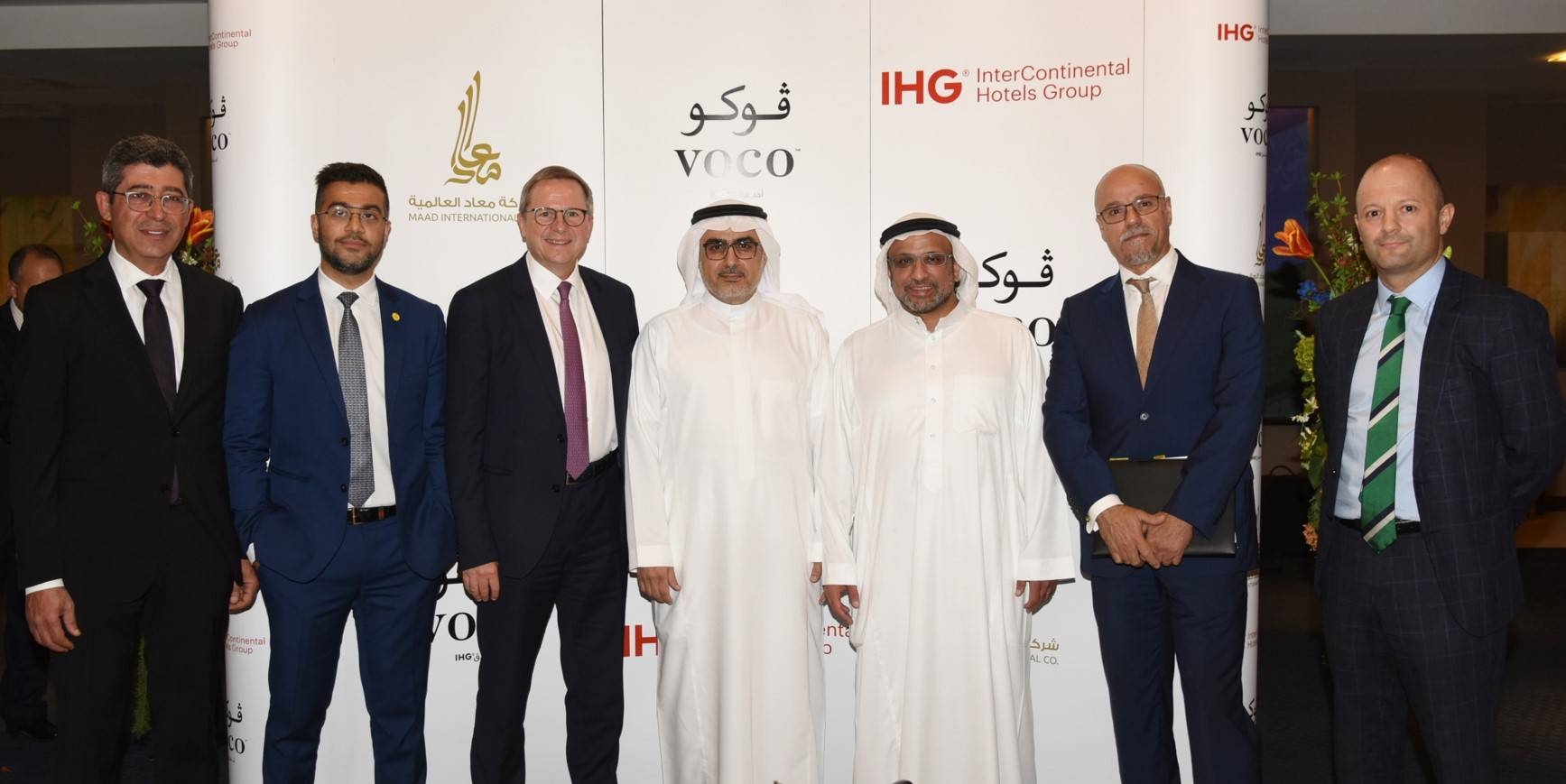 Top executives of the signatory companies pose for a group photo during the event
