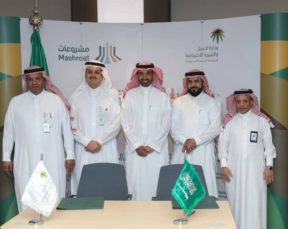 Some officials of signatory companies pose for a group photo 