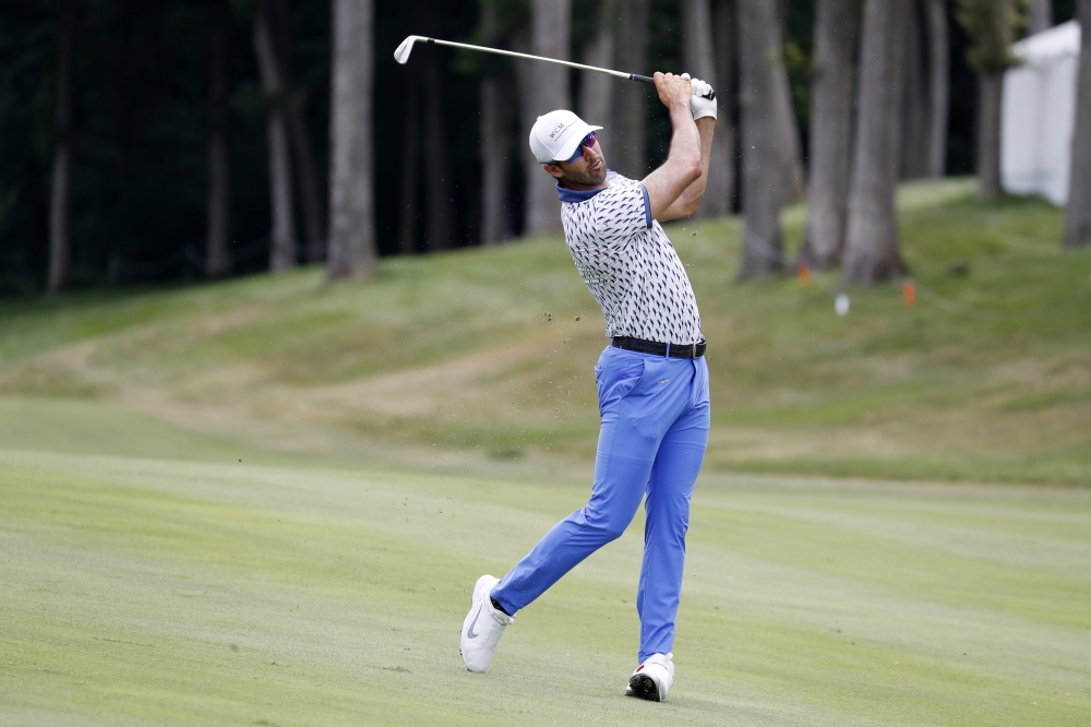 Cameron Tringale plays his second shot on the 17th hole during the third round of the John Deere Classic golf tournament at TPC Deere Run at Silvis, IL, USA, on Saturday. — Reuters