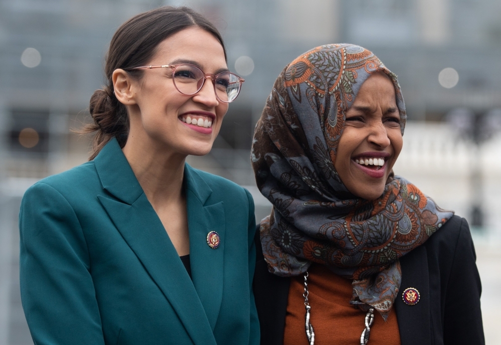 In this file photo taken on Feb. 7, 2019 US Representative Alexandria Ocasio-Cortez, Democrat of New York, and US Representative Ilhan Omar (R), Democrat of Minnesota, attend a press conference calling on Congress to cut funding for US Immigration and Customs Enforcement (ICE) and to defund border detention facilities, outside the US Capitol in Washington, DC. — AFP