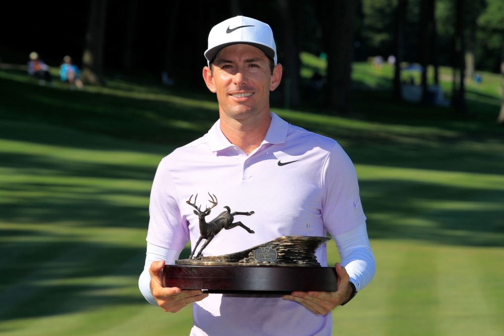 Dylan Frittelli of South Africa celebrates with the trophy after winning the John Deere Classic at TPC Deere Run in Silvis, Illinois, on Sunday. — AFP