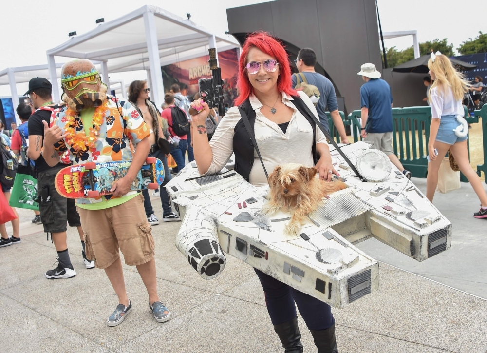 In this file photo taken on July 23, 2016 women play the parts from Star Wars, Hera Syndulla (L) and Sabine Wren during Comic-Con International 2016 in San Diego, California. — AFP