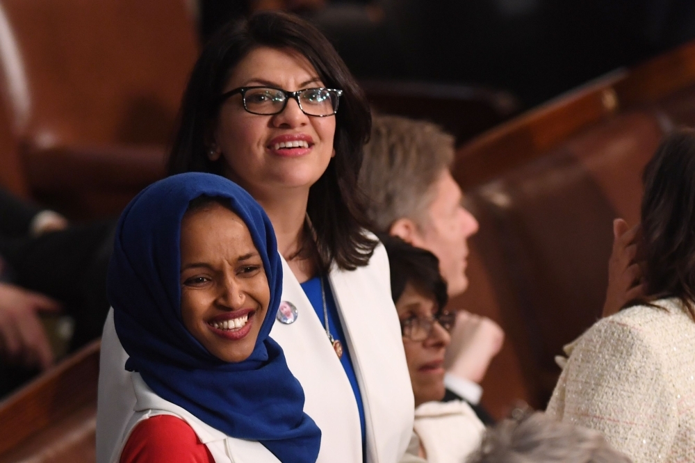 US Representative Ilhan Omar, left, and US Representative from Michigan Rashida Tlaib arrive for the State of the Union address at the US Capitol in Washington in this Feb. 5, 2019 file photo. — AFP