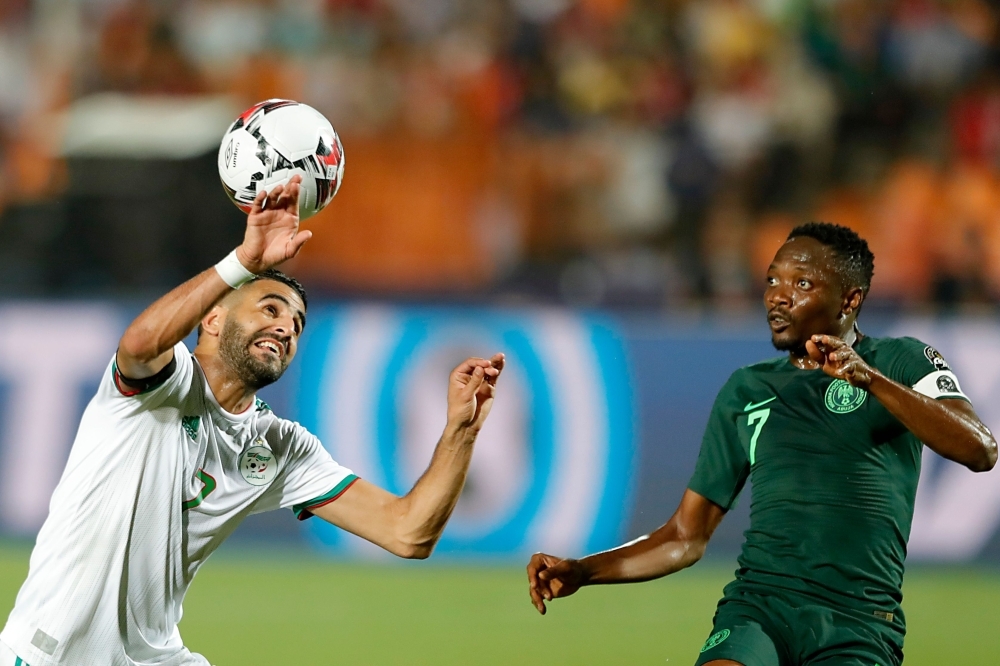 Algeria's forward Riyad Mahrez (L) vies for the ball with Nigeria's forward Ahmed Musa during the 2019 Africa Cup of Nations semifinal football match between Algeria and Nigeria at the Cairo International stadium in Cairo, on Sunday. — AFP