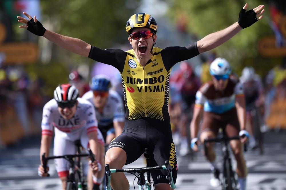 Belgium's Wout van Aert celebrates as he wins on the finish line of the tenth stage of the 106th edition of the Tour de France cycling race between Saint-Flour and Albi, on Monday. — AFP